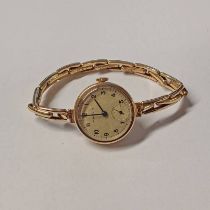 9CT GOLD WRISTWATCH MARKED MARVIN TO FRONT & TO WORKS ON 9CT GOLD EXPANDING BRACELET.