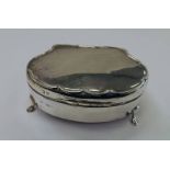 SILVER JEWELLERY BOX WITH BOW FRONT ON 4 SHAPED SUPPORTS,