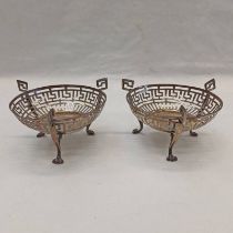 PAIR OF SILVER PIERCED 3 - HANDLED DISHES ON PAW FEET,