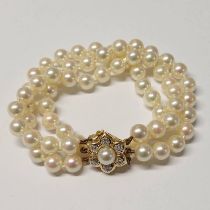 CULTURED PEARL TRIPLE STRAND BRACELET WITH 18CT GOLD PEARL & DIAMOND FLORAL CLASP - 17.