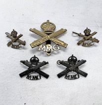 FIVE MOTOR MACHINE GUN CORPS BADGES