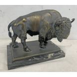 BRONZED SCULPTURE OF A BISON ON A HARDSTONE BASE,