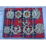 SELECTION OF CAP BADGES TO INCLUDE THE ROYAL SCOTS, SCOTTISH KINGS OWN BORDERERS,