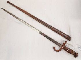 FRENCH 1874 GRAS BAYONET WITH 52CM LONG BLADE MARKED ETIENNE 1878 TO SPINE WITH ITS STEEL SCABBARD