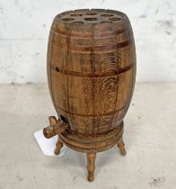 CARVED WOODEN POP UP CIGARETTE DISPENSER IN THE FORM OF A WHISKY BARREL ON A STAND,