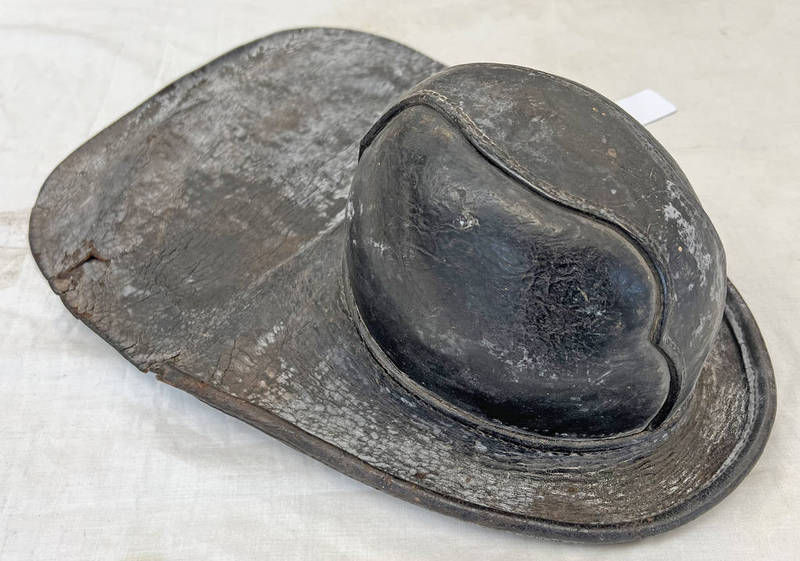 ANTIQUE LEATHER FIREMAN'S HELMET WITH LARGE TAIL