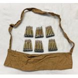 6 CLIPS CONTAINING 5 INERT 303 ROUNDS WITH A CLOTH BANDOLIER