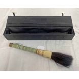 MIDDLE EASTERN GREEN HARDSTONE BODIED BRUSH WITH BONE MOUNT IN DISPLAY CASE,