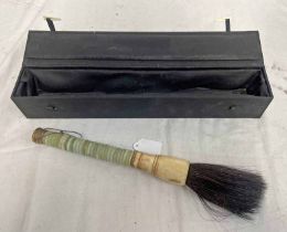 MIDDLE EASTERN GREEN HARDSTONE BODIED BRUSH WITH BONE MOUNT IN DISPLAY CASE,