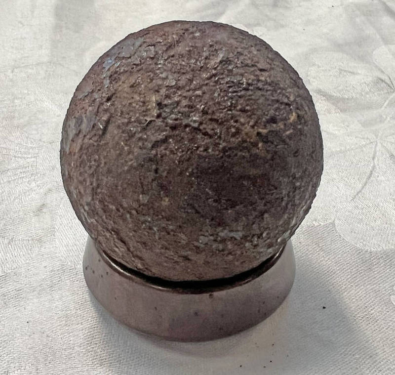 CANNON BALL ON CIRCULAR STAND,