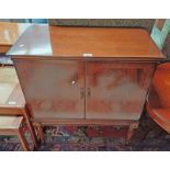 20TH CENTURY INLAID MAHOGANY CABINET WITH 2 PANEL DOORS ON REEDED SUPPORTS.