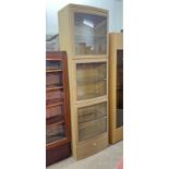 OAK DISPLAY CABINET WITH 3 GLAZED PANEL DOORS OPENING TO GLASS SHELVED INTERIOR OVER SINGLE DRAWER.