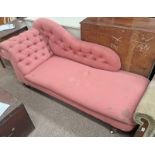 19TH CENTURY OVERSTUFFED BUTTON BACK CHAISE LONGUE ON TURNED MAHOGANY SUPPOTS