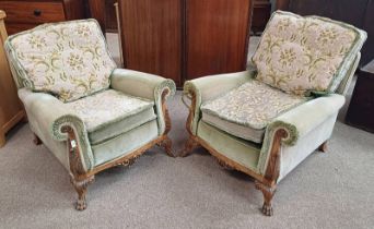 PAIR OF 19TH CENTURY CARVED WALNUT FRAMED OVERSTUFFED ARMCHAIRS ON DECORATIVE PAW FEET