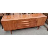 TEAK SIDEBOARD WITH 3 CENTRALLY SET DRAWERS FLANKED BY 2 PANEL DOORS,