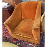 LATE 19TH CENTURY MAHOGANY FRAMED OVERSTUFFED ARMCHAIR ON SQUARE TAPERED SUPPORTS.