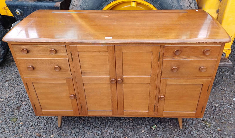 ERCOL ELM SIDEBOARD WITH 2 CENTRALLY SET PANEL DOORS FLANKED TO EACH SIDE BY 2 DRAWERS OVER 2 PANEL