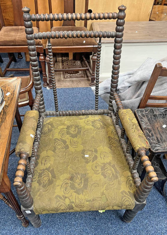 LATE 19TH CENTURY MAHOGANY OPEN ARMCHAIR WITH BOBBIN DECORATION ON BOBBIN SUPPORTS