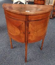 20TH CENTURY INLAID MAHOGANY DEMI-LUNE CABINET WITH 2 PANEL DOORS ON SQUARE TAPERED SUPPORTS,