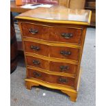 YEW WOOD CHEST OF DRAWERS WITH SHAPED FRONT & 4 DRAWERS ON BRACKET SUPPORTS,