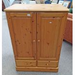 PINE CABINET WITH 2 PANEL DOORS OVER 2 DRAWERS,