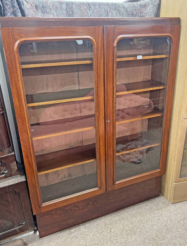 19TH CENTURY MAHOGANY BOOKCASE WITH 2 GLAZED PANEL DOORS OPENING TO SHELVED INTERIOR ON PLINTH BASE,