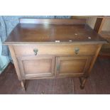 EARLY 20TH CENTURY OAK CABINET WITH SINGLE LONG DRAWER OVER 2 PANEL DOORS ON TURNED SUPPORTS,