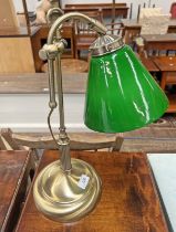 GILT METAL ADJUSTABLE TABLE LAMP WITH GREEN GLASS SHADE ON CIRCULAR BASE