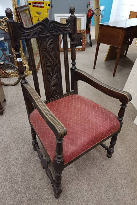 19TH CENTURY OAK OPEN ARMCHAIR WITH DECORATIVE CARVED BACK ON TURNED SUPPORTS