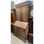 19TH CENTURY MAHOGANY BUREAU BOOKCASE WITH 2 PANEL DOORS WITH INLAID DECORATION OVER BASE WITH FALL