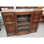 20TH CENTURY OAK BREAK FRONT CABINET WITH CENTRALLY SET GLAZED PANEL DOOR FLANKED BY 2 PANEL DOORS