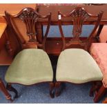 PAIR OF 20TH CENTURY MAHOGANY HAND CHAIRS WITH FRETWORK BACKS ON SHAPED SUPPORTS