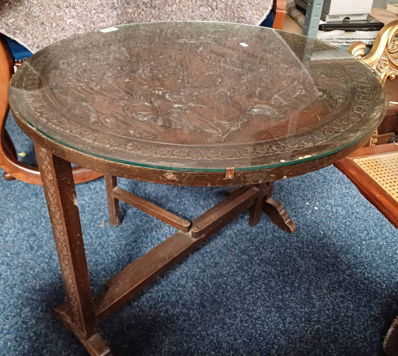 EASTERN HARDWOOD FLIP TOP CIRCULAR TABLE WITH CARVED ORIENTAL SCENE DECORATION TO TOP