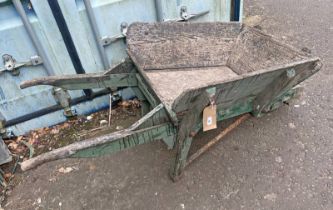 20TH CENTURY WOODEN WHEEL BARROW Condition Report: Tyre flat weathered rusty but