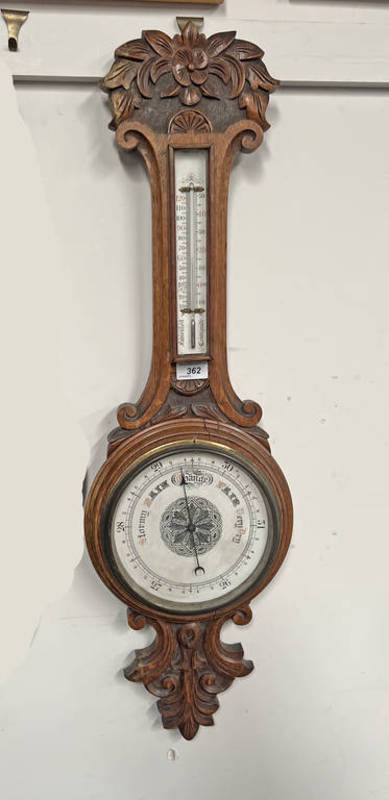 EARLY 20TH CENTURY CARVED OAK CASED ANEROID BAROMETER