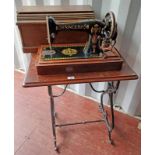 MAHOGANY CASED SINGER SEWING MACHINE & SEWING TABLE ON DECORATIVE CAST METAL SUPPORTS, MACHINES NO,