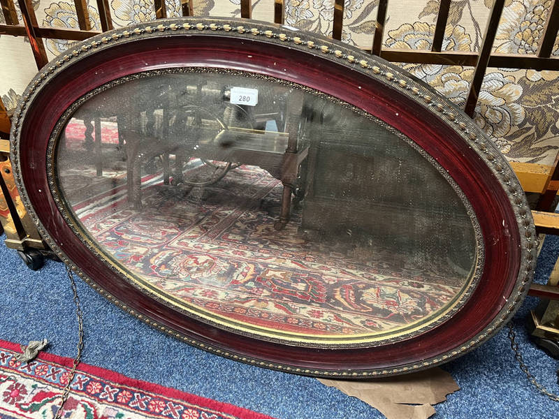 LATE 19TH CENTURY ROSEWOOD FRAMED OVAL MIRROR WITH GILT DECORATION