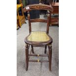 20TH CENTURY FAUX ROSEWOOD CHILD'S CHAIR WITH GILT DECORATION & BERGERE PANEL SEAT ON SPLAYED
