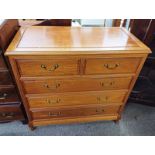 HARDWOOD CHEST OF 2 SHORT OVER 3 LONG DRAWERS ON SHAPED SUPPORTS,