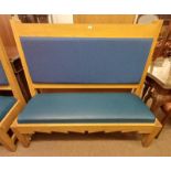 OAK BENCH WITH PADDED BACK & SEAT ON SQUARE SUPPORTS.