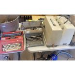 2 CASED SEWING MACHINES,