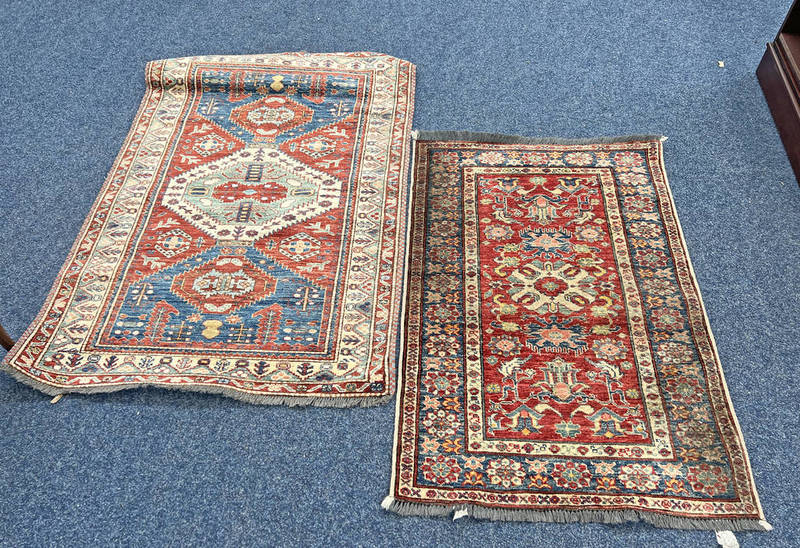 TWO MIDDLE EASTERN RUGS 118 X 80 CM AND 140 X 97 CM Condition Report: lot weighs
