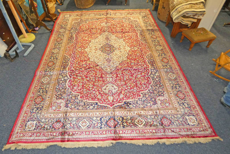 RICH RED GROUND FULL PILE CASHMERE CARPET WITH TRADITIONAL FLORAL MEDALLION DESIGN - 330 X 232 CM