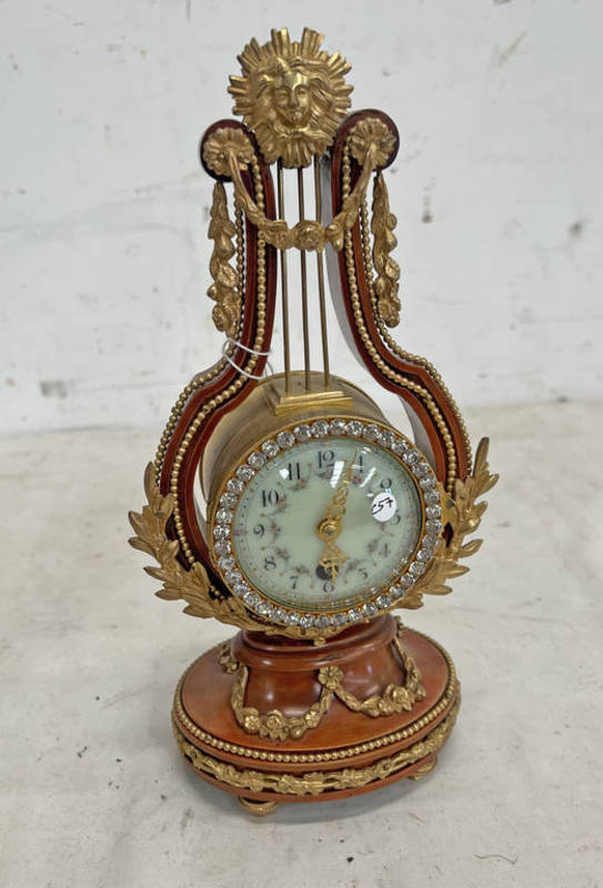 20TH CENTURY LYRE HARP SHAPED CLOCK WITH DECORATIVE METAL MOUNTS & ENAMELLED FACE,