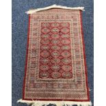 RED GROUND MIDDLE EASTERN RUG 120 X 70 CM