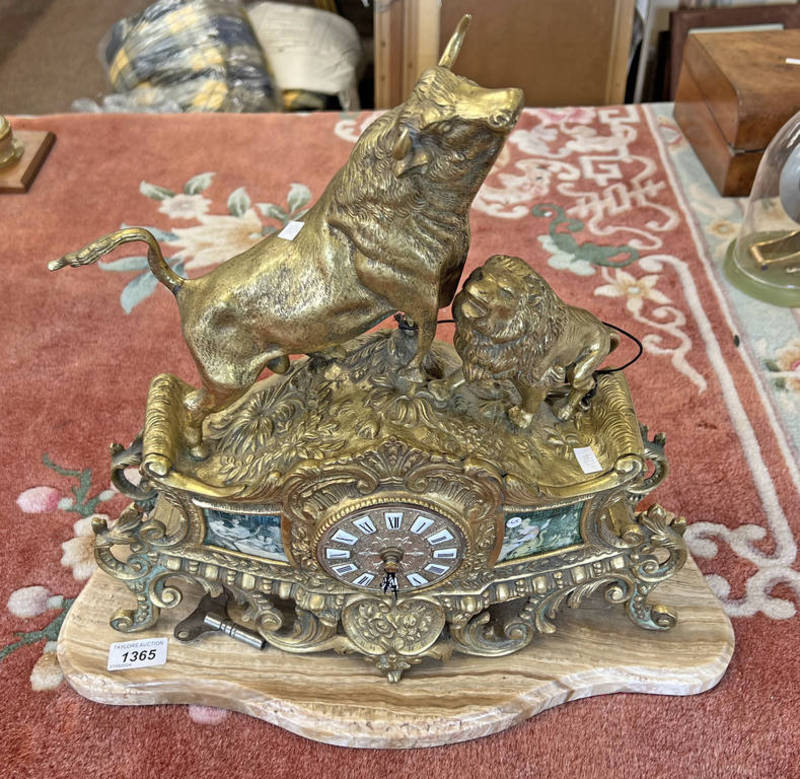 ORNAMENTAL BRASS CLOCK WITH OX & LION ON MARBLE BASE,