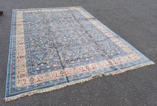 LARGE EGG BLUE GROUND FULL PILE CASHMERE CARPET ALL OVER FLORAL PATTERN WITH A GOLD BORDER.