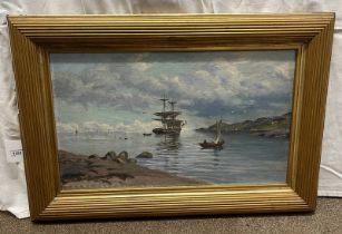 SAILING SHIP IN A HIGHLAND BAY SIGNED INDISTINCTLY GILT FRAMED OIL PAINTING 38 X 64 CM