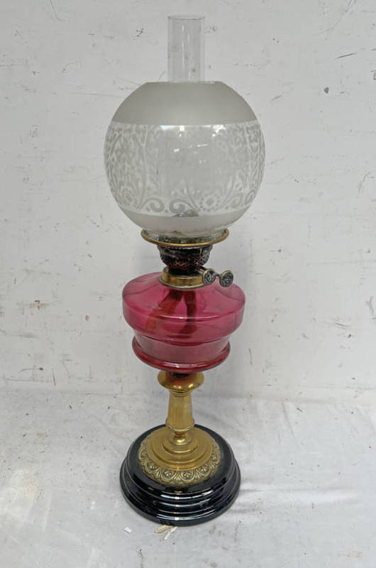 LATE 19TH CENTURY OR EARLY 20TH CENTURY CRANBERRY GLASS PARAFFIN LAMP WITH ETCHED GLASS GLOBE