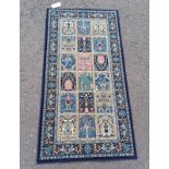 BLUE GROUND FINE WOVEN WOVEN IRANIAN RUNNER WITH ALL OVER PERSIAN PANEL DESIGN 160 X 85CM